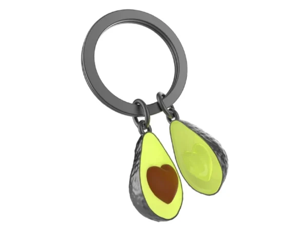 Compre o porta chaves abacate da marca meta[l]morphose. Design premium em metal fundido com caroço de coração e pintura esmaltada. Garanta o seu amuleto exclusivo!