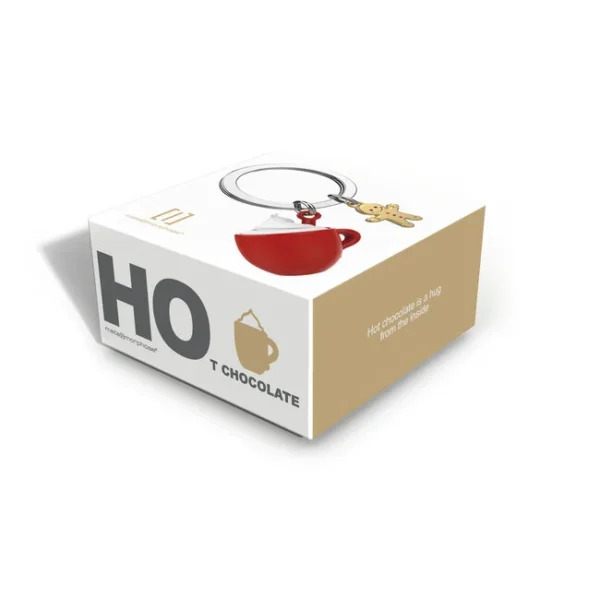 A embalagem original de cartão protege o Porta-chaves Chocolate Quente com Caneca e Biscoito Metalmorphose no seu interior. Além disso, a caixa de oferta apresenta uma janela transparente que deixa ver o Porta-chaves Chocolate Quente com Caneca e Biscoito Metalmorphose com total clareza.